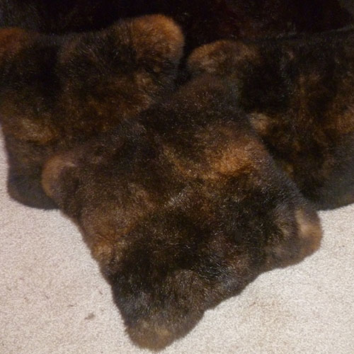Three possum fur cushions