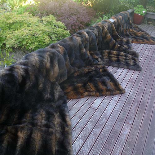 Fur throw stacked queen bed